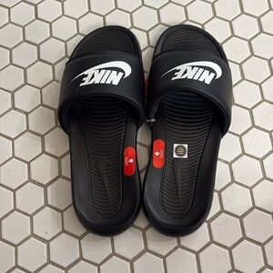 Black Nike slides